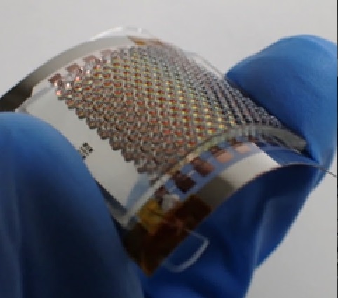 Flexible thin-film thermoelectric generators with microlenses